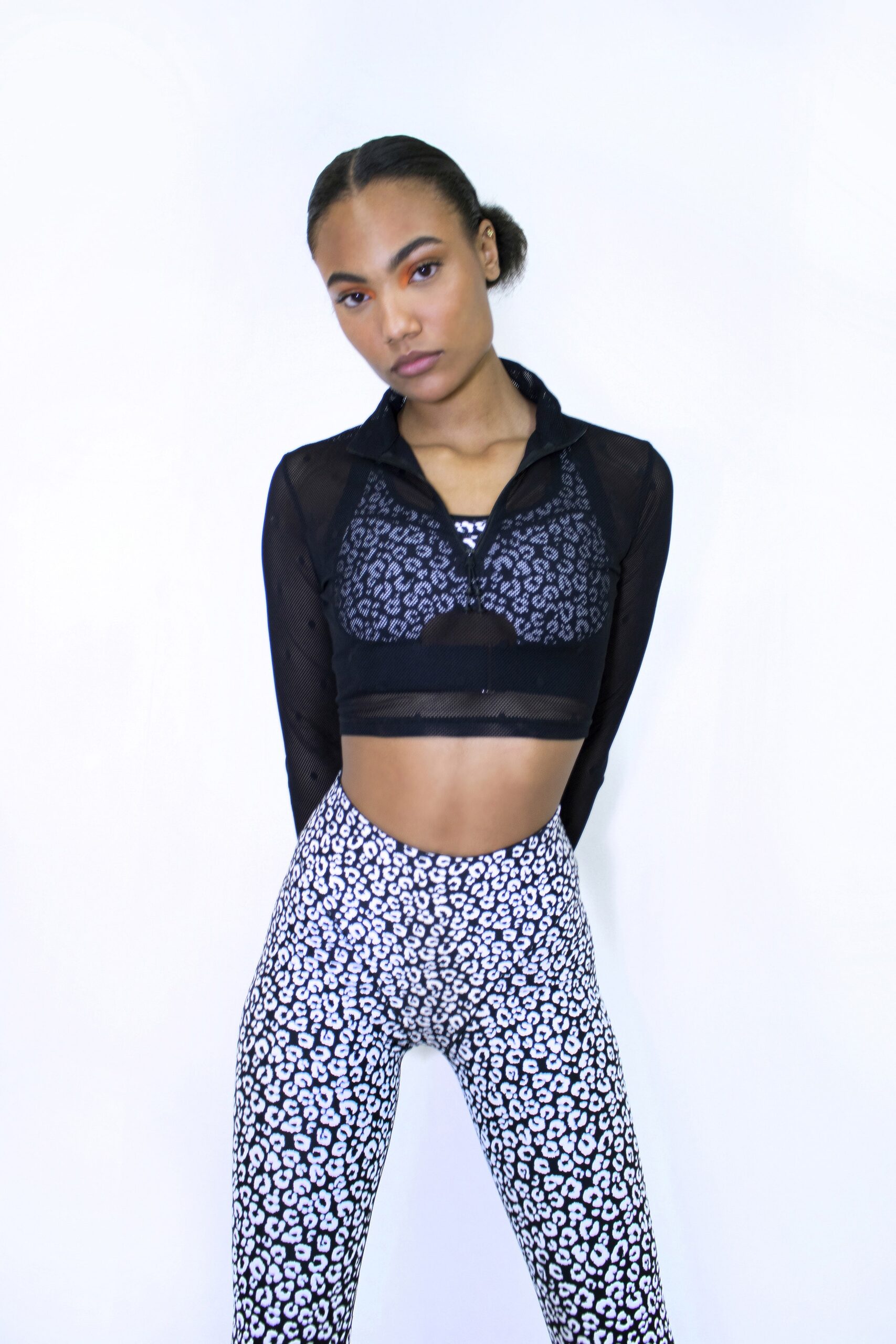 black mesh long-sleeve top and printed leggings