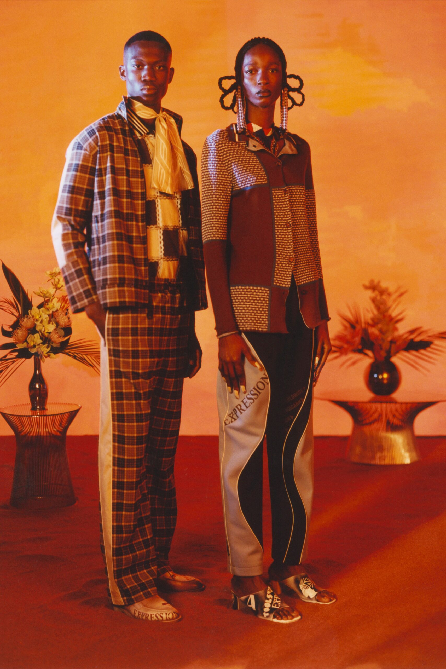 brown printed shirt and black pants