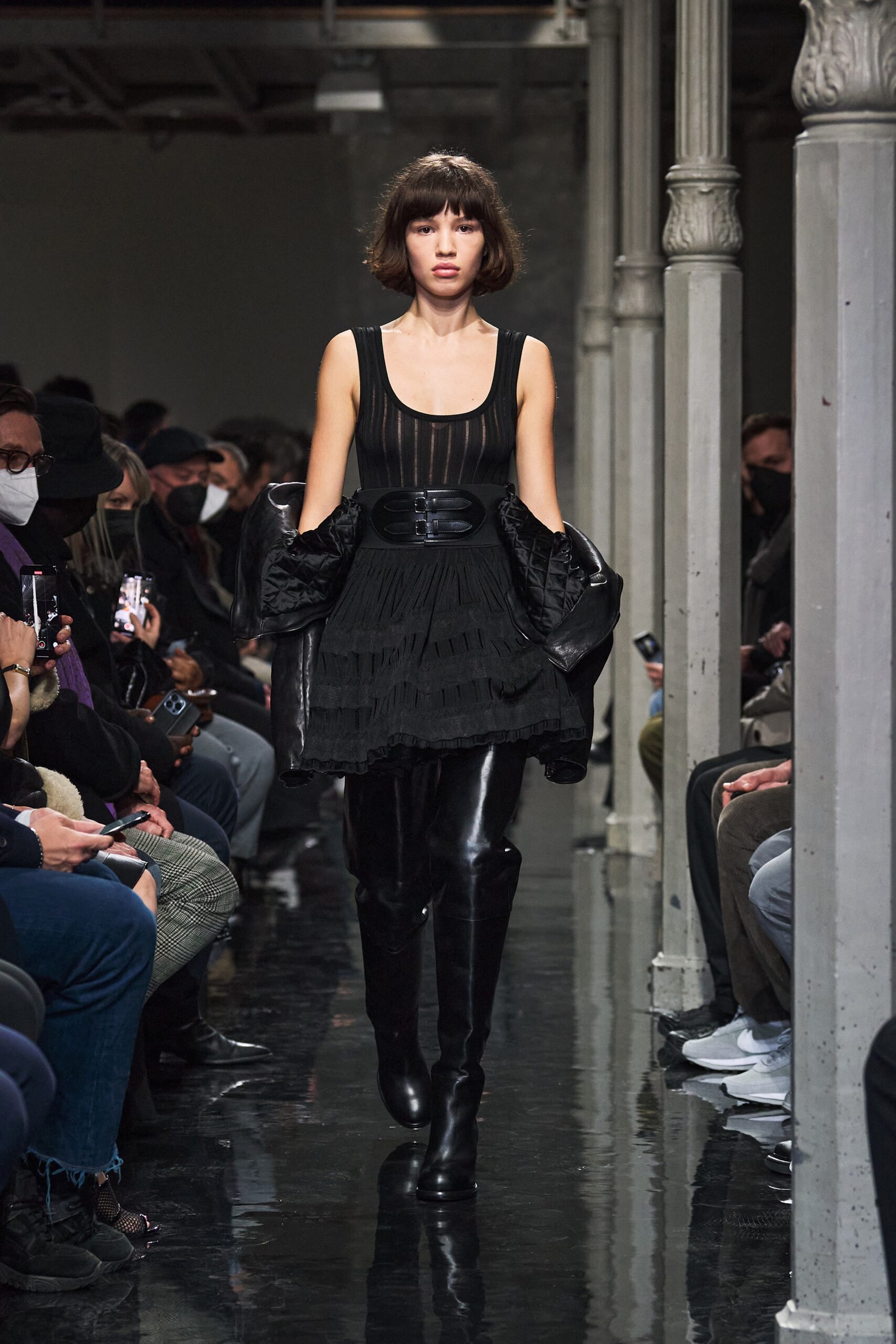 black pleated mini dress with oversized coat