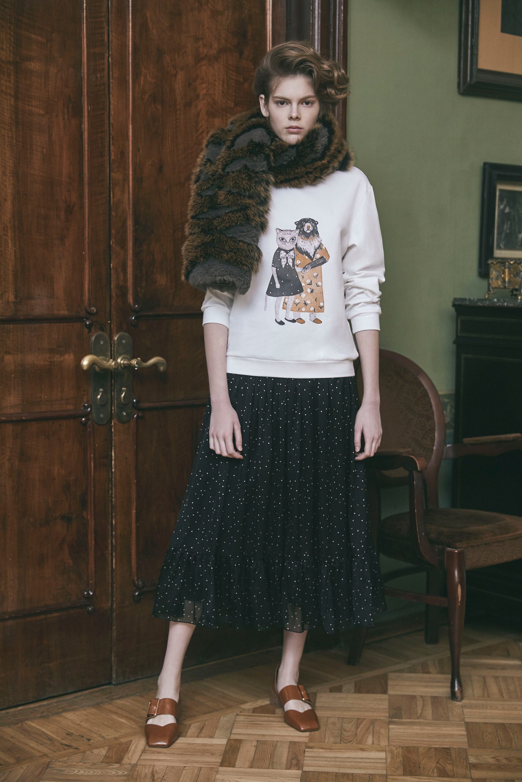 white printed sweater with black midi skirt