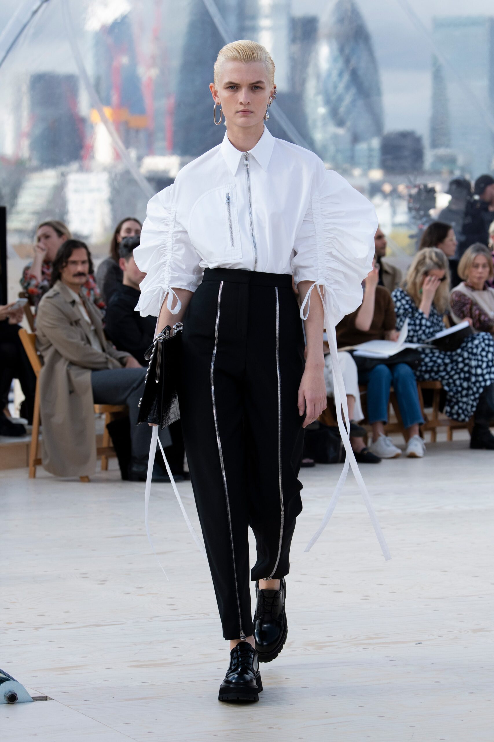 white pleated shirt and black pants