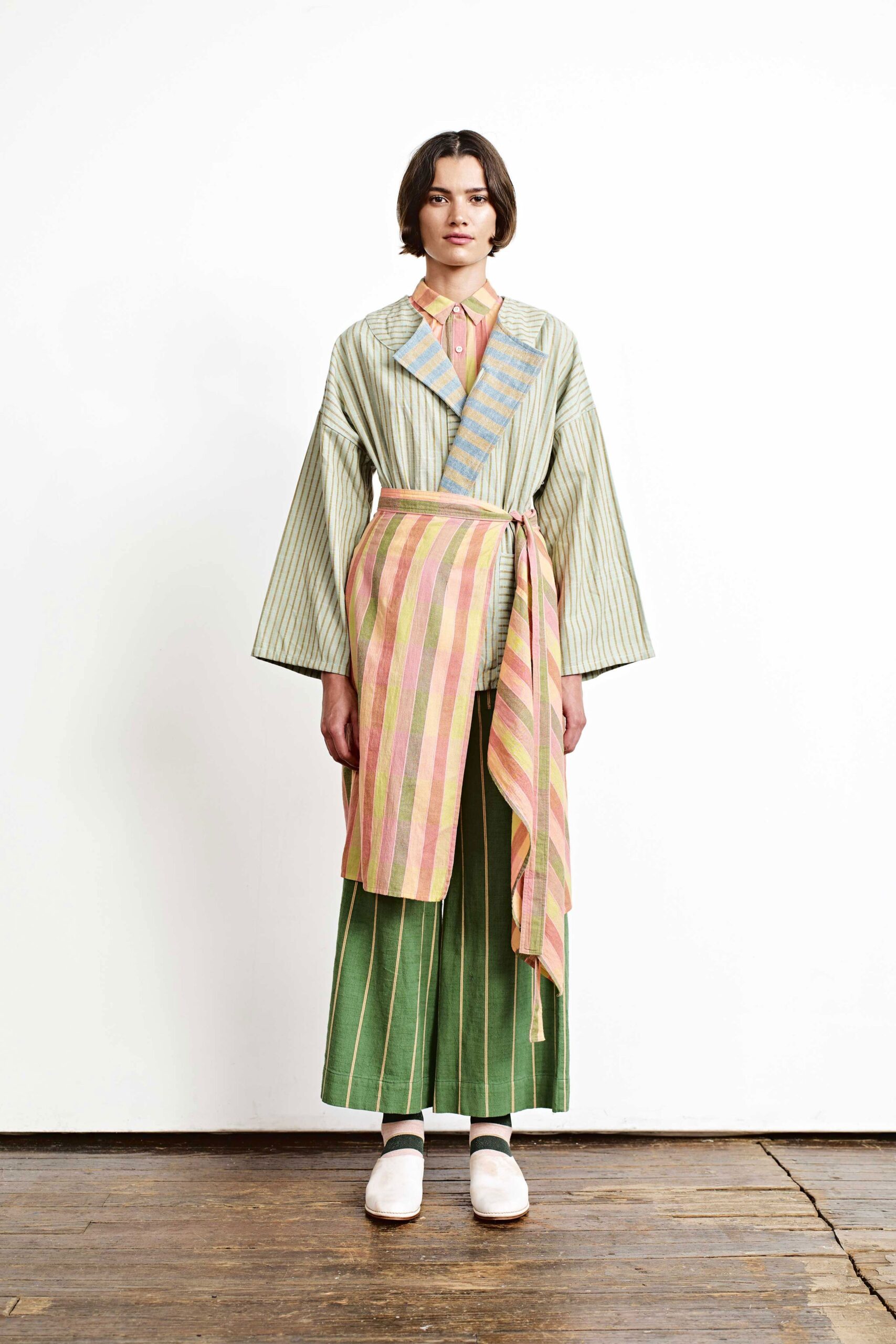 green striped blouse and pleated skirt