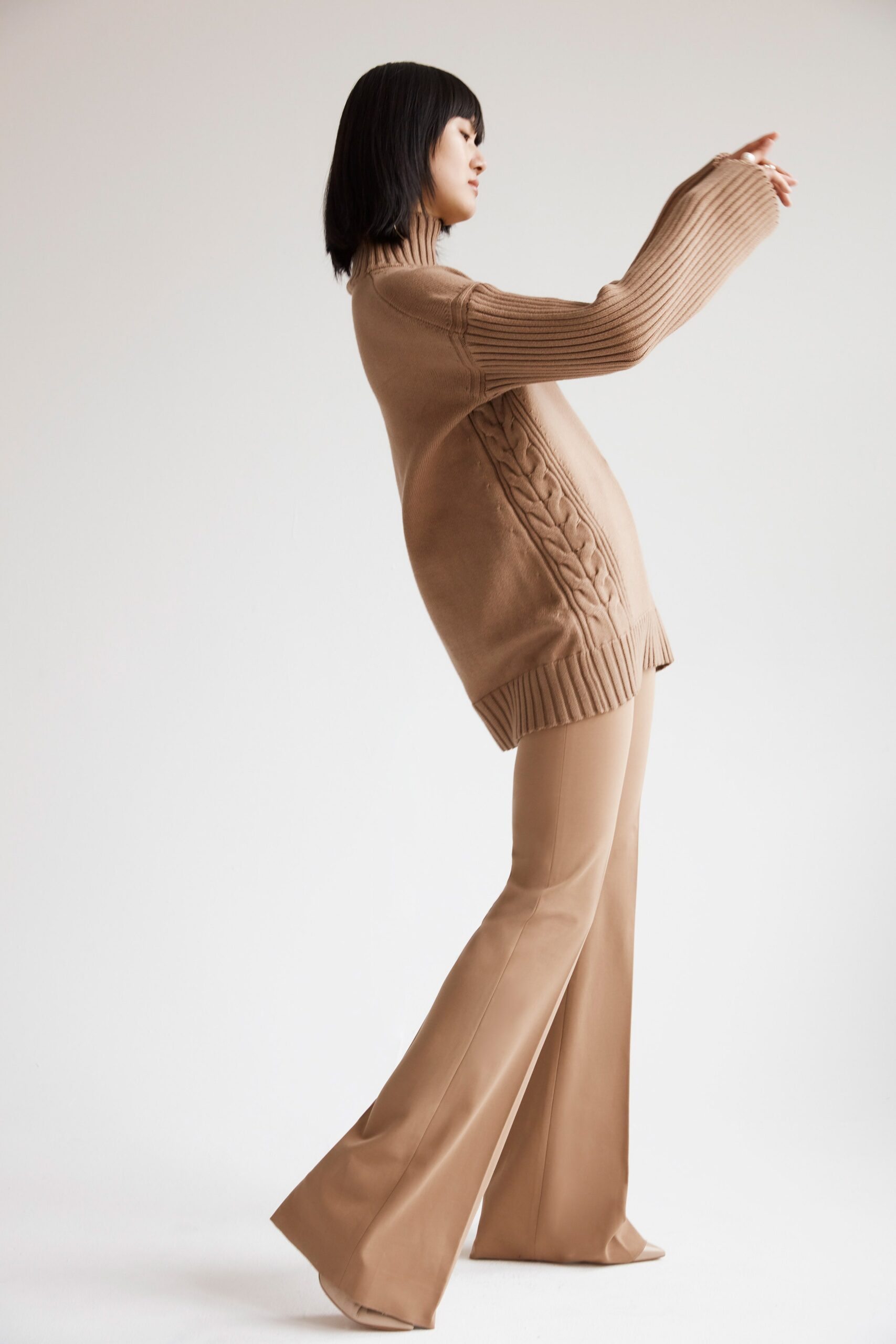 beige relaxed sweater with flared pants