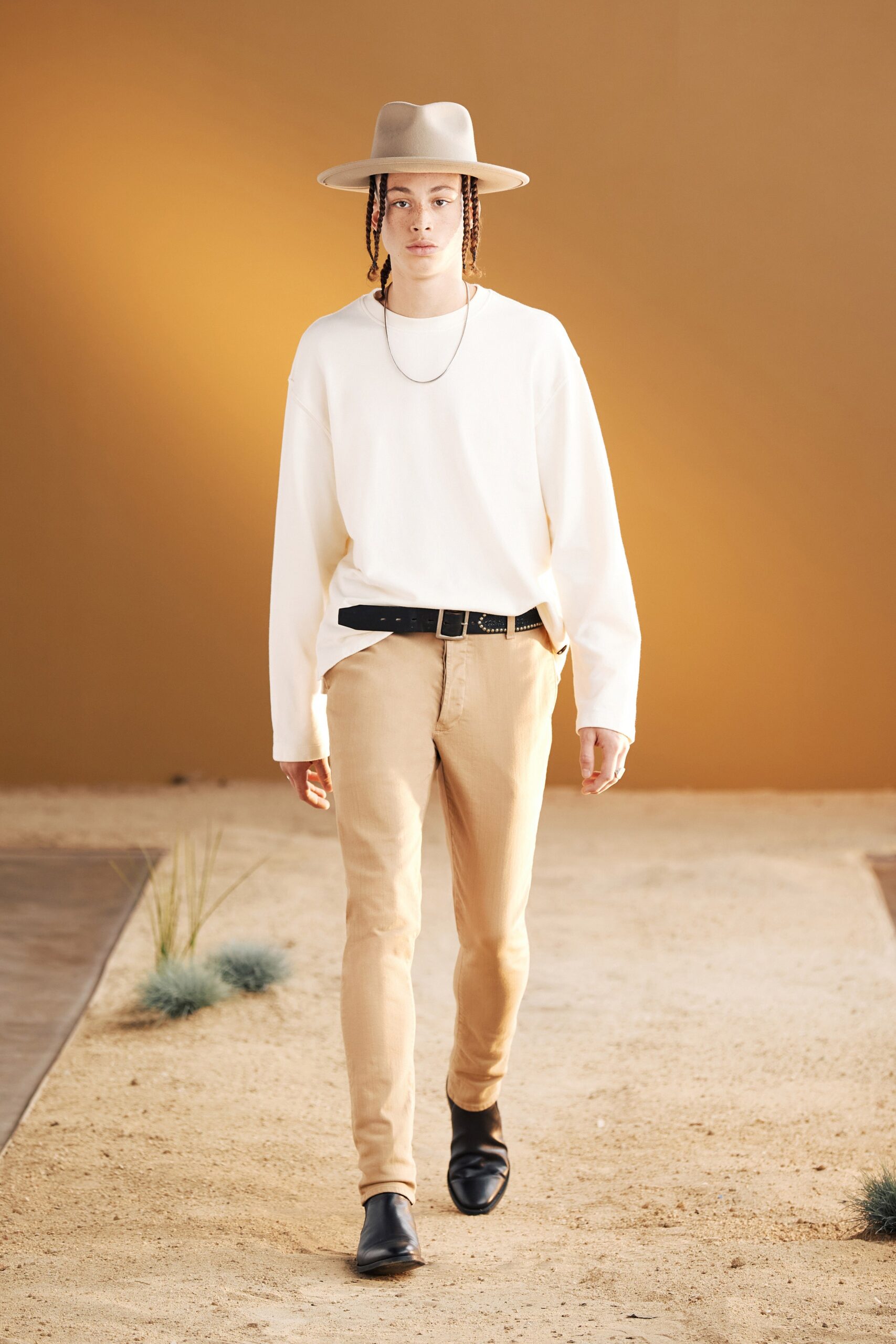 white relaxed shirt with beige pants