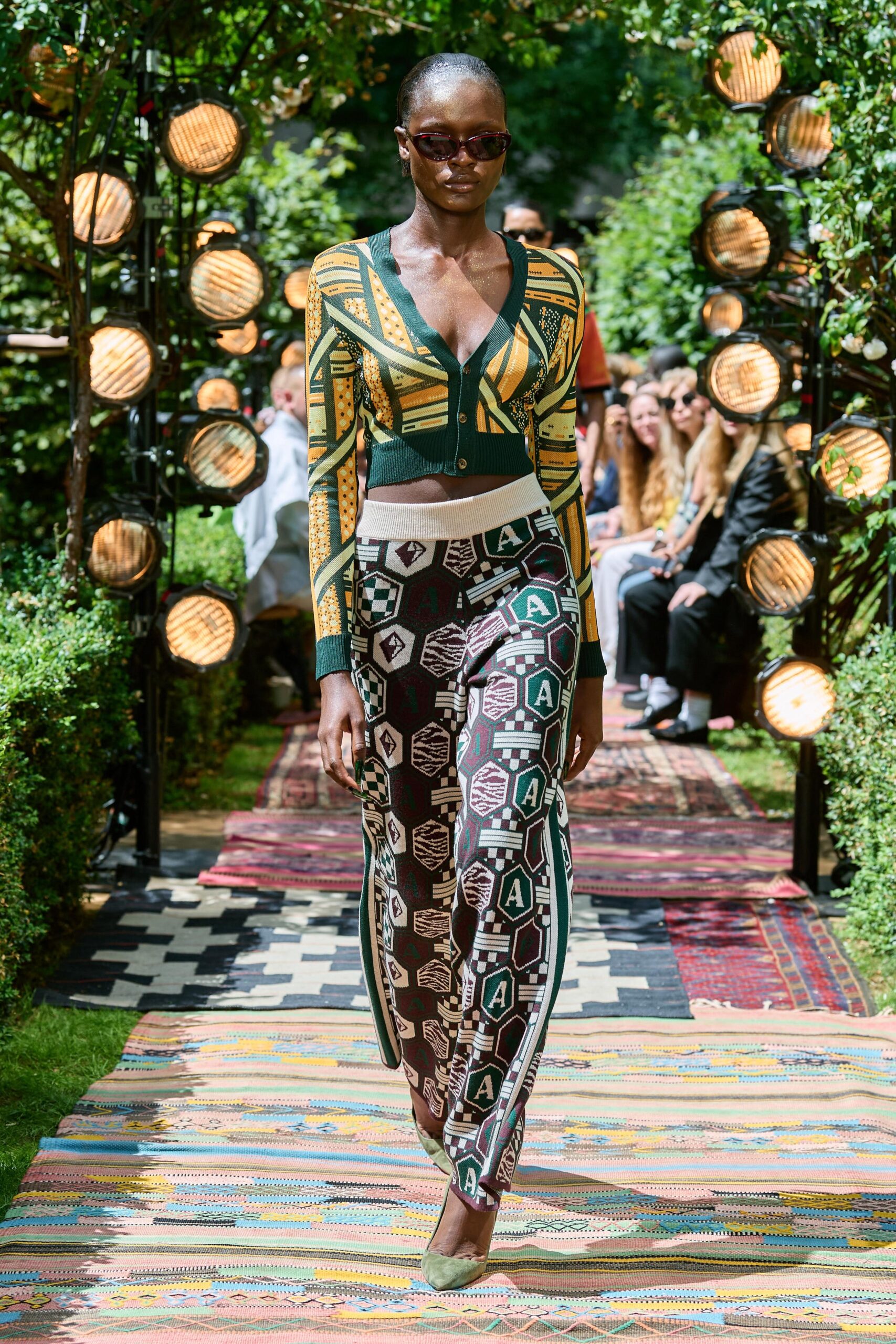 fitted green printed top with black pants