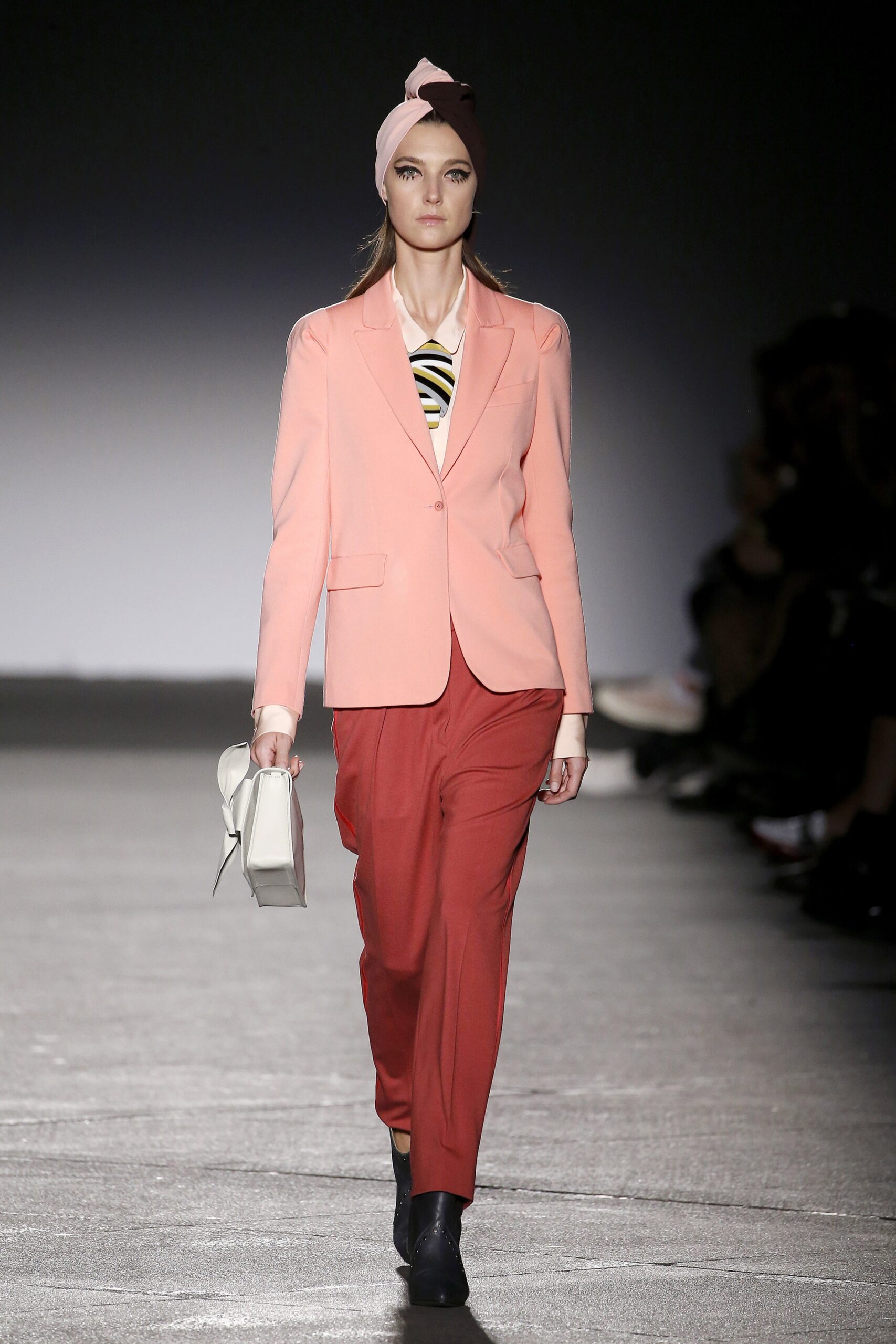 pink tailored blazer with red pants