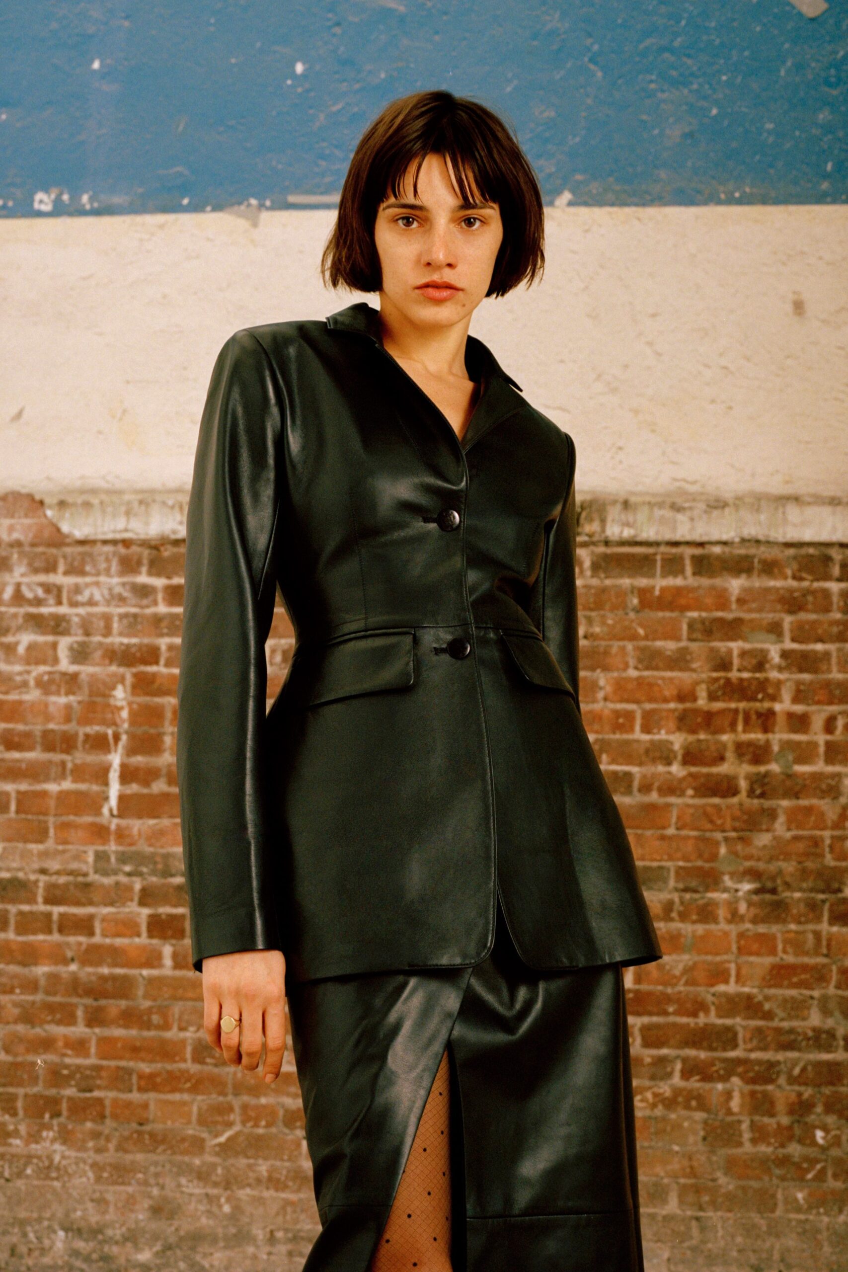 black leather long-sleeve collared fitted structured buttoned blazer