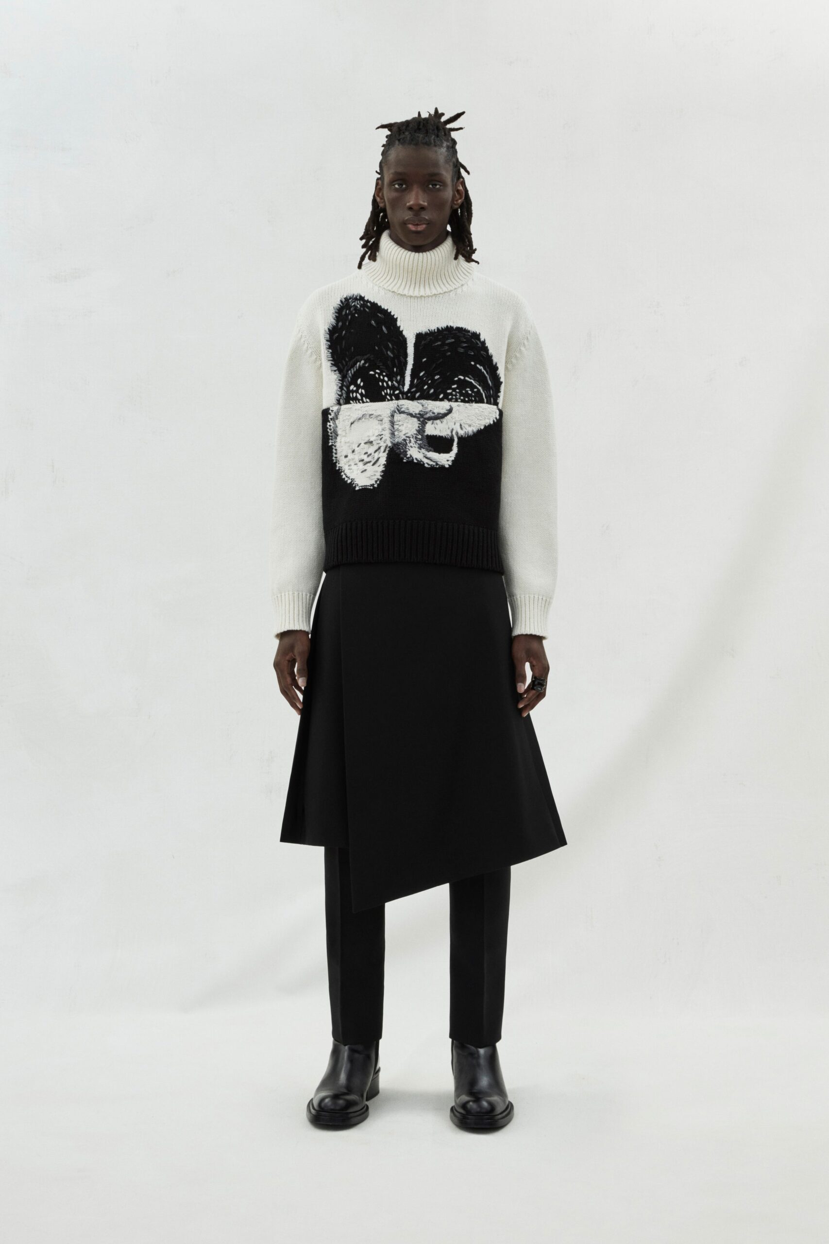 black and white fitted sweater with asymmetric skirt