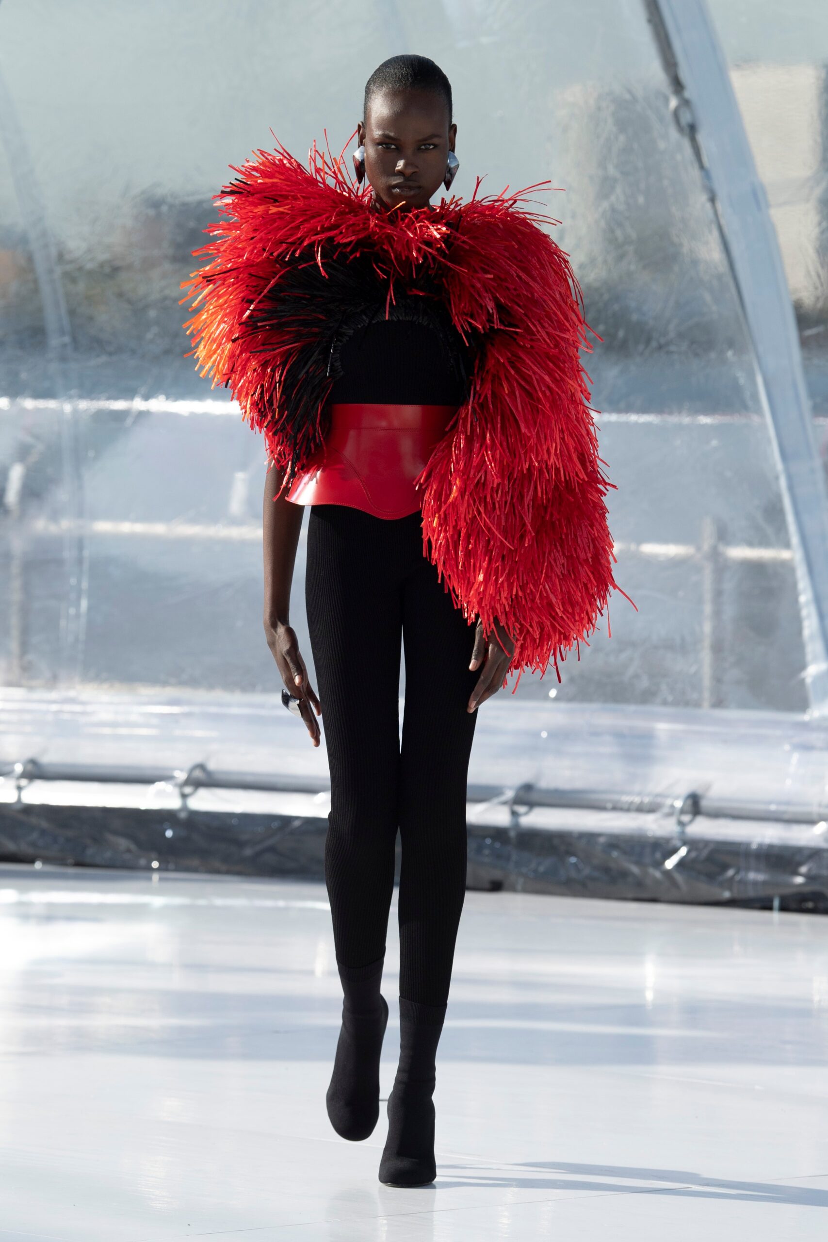 red faux-fur top with black pants