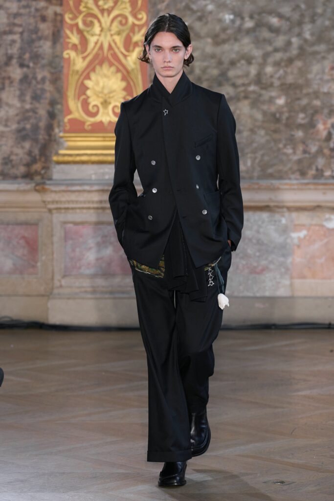 black tailored suit with gloves