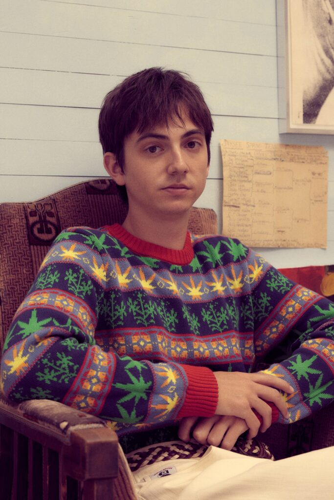 A relaxed multicolor cotton sweater with long sleeves and a crew neck featuring a vibrant print.
