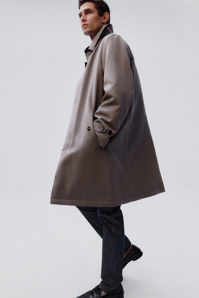 An oversized gray coat with long sleeves and a collared design.