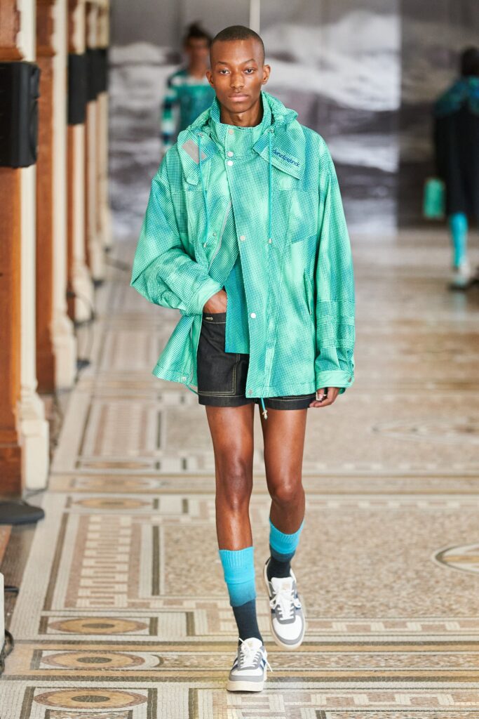 oversized green jacket with black shorts