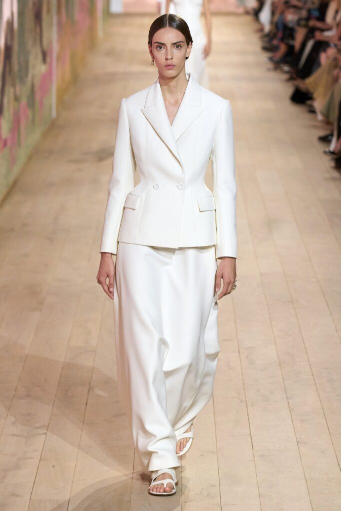 white tailored suit with flat shoes