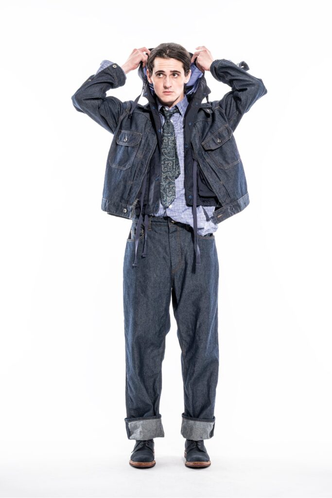A relaxed blue denim jacket with long sleeves and collared design paired with matching pants.