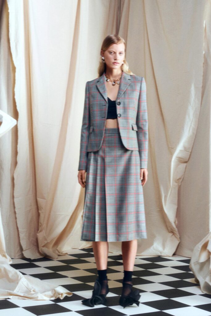 tailored gray blazer with pleated skirt