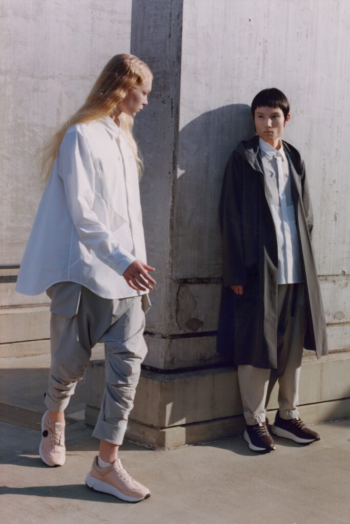 A relaxed gray jacket with long sleeves and a collared design paired with matching pants.