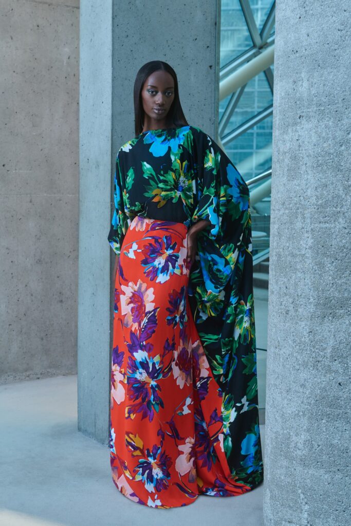 A relaxed floral silk dress with a high neckline and flared silhouette.