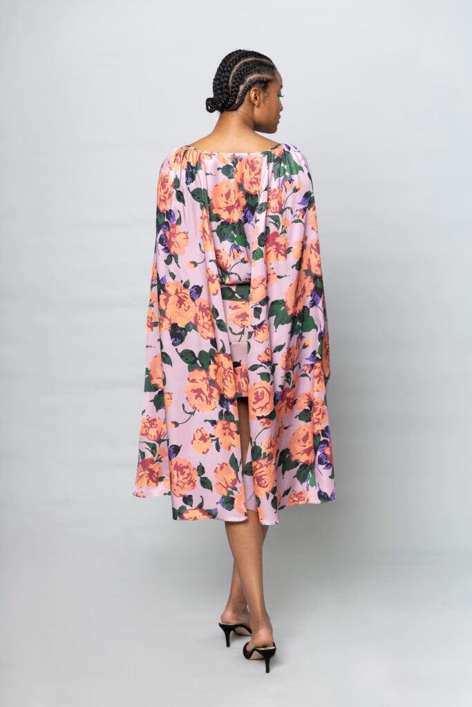 A relaxed pink dress with long sleeves and a floral pattern, perfect for casual outings.