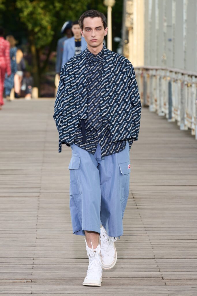 A relaxed fit blue printed shirt paired with loose cotton pants for a casual look.