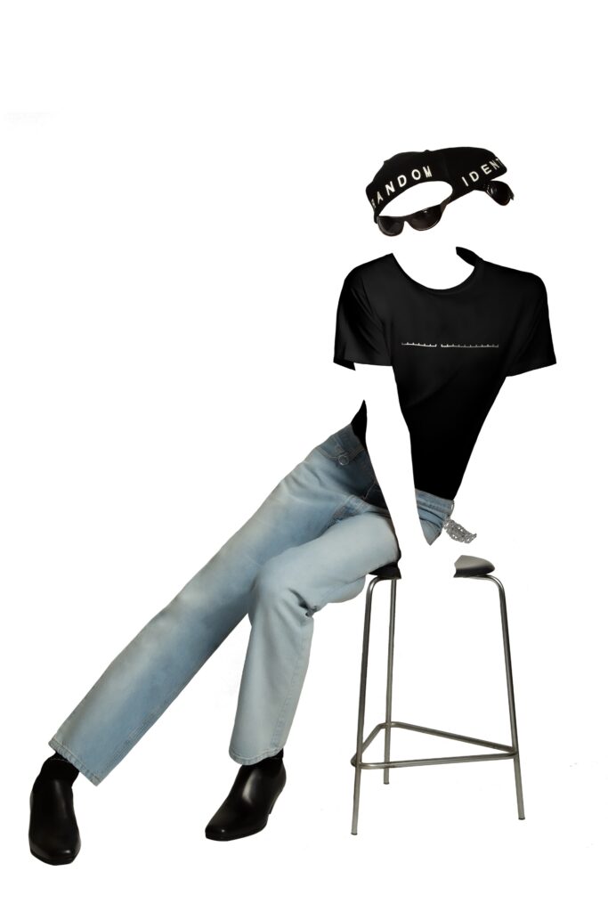 A relaxed fit black t-shirt paired with high-waisted straight-leg blue pants.