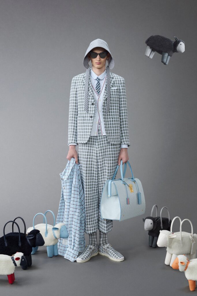 A tailored blue checked suit with long sleeves and a collared shirt.