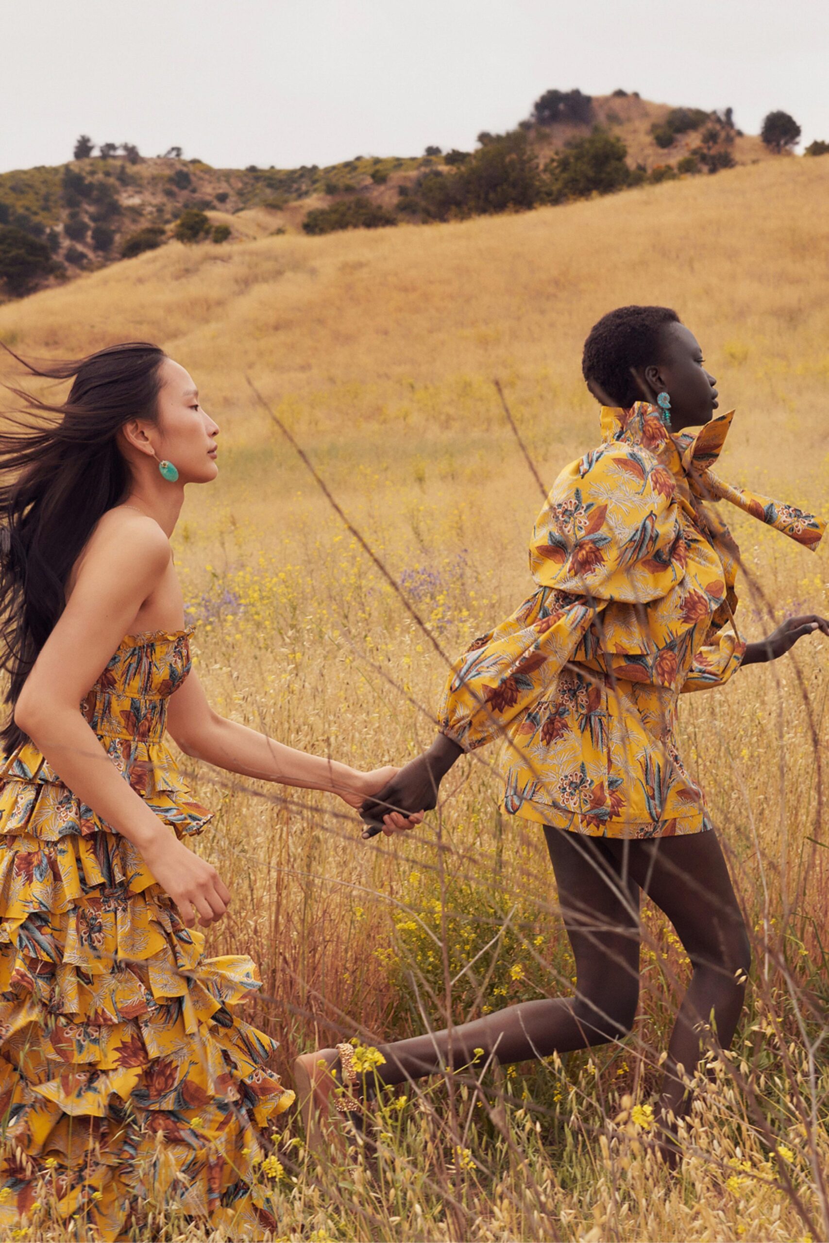 A fitted yellow dress with an off-shoulder design and flared silhouette.