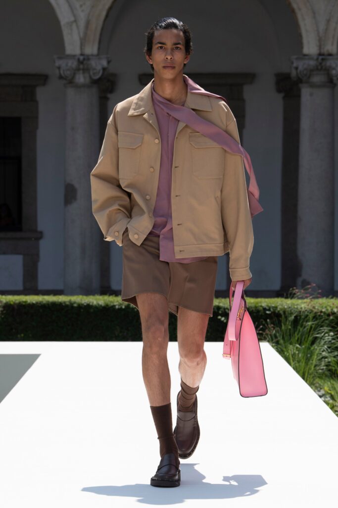 beige jacket pink top brown shorts