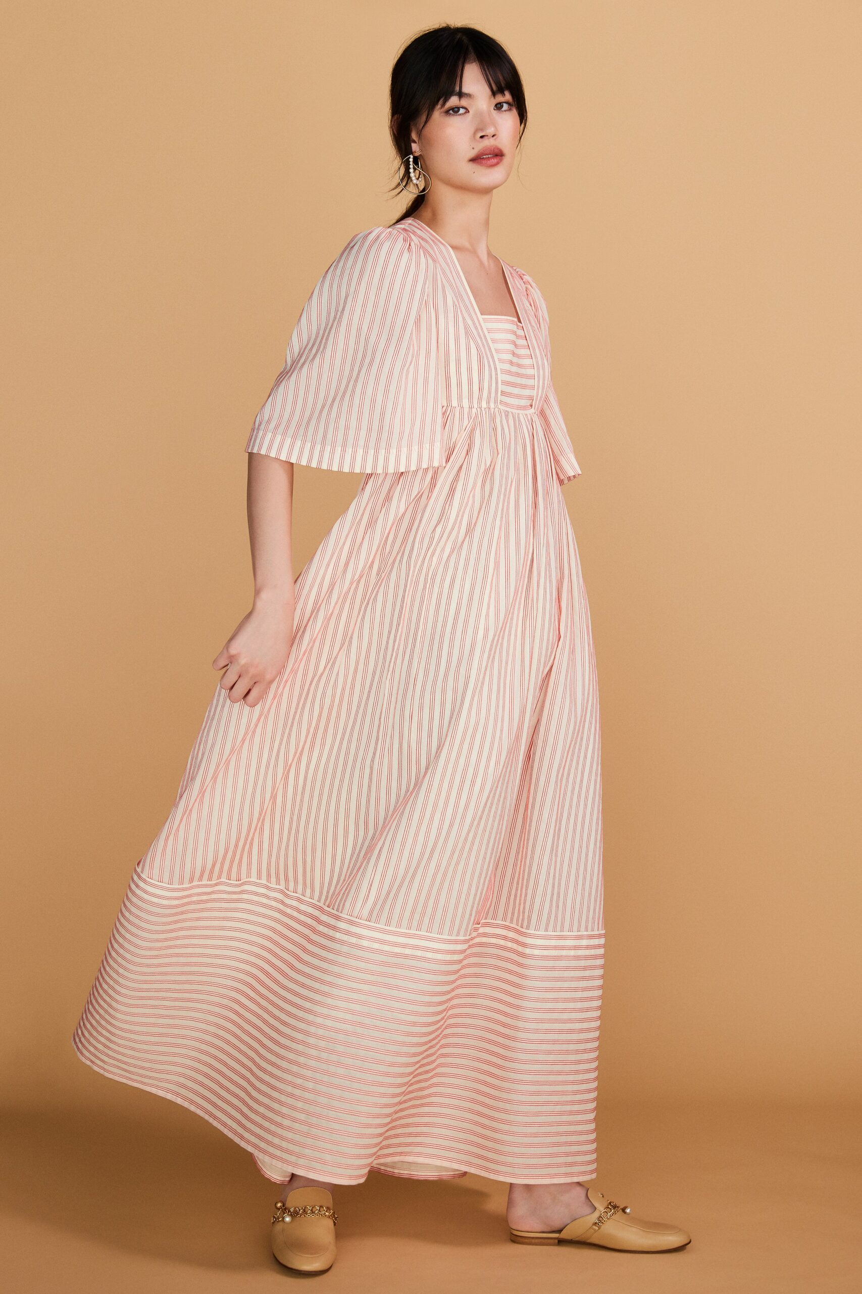 pink and white striped maxi dress with cape