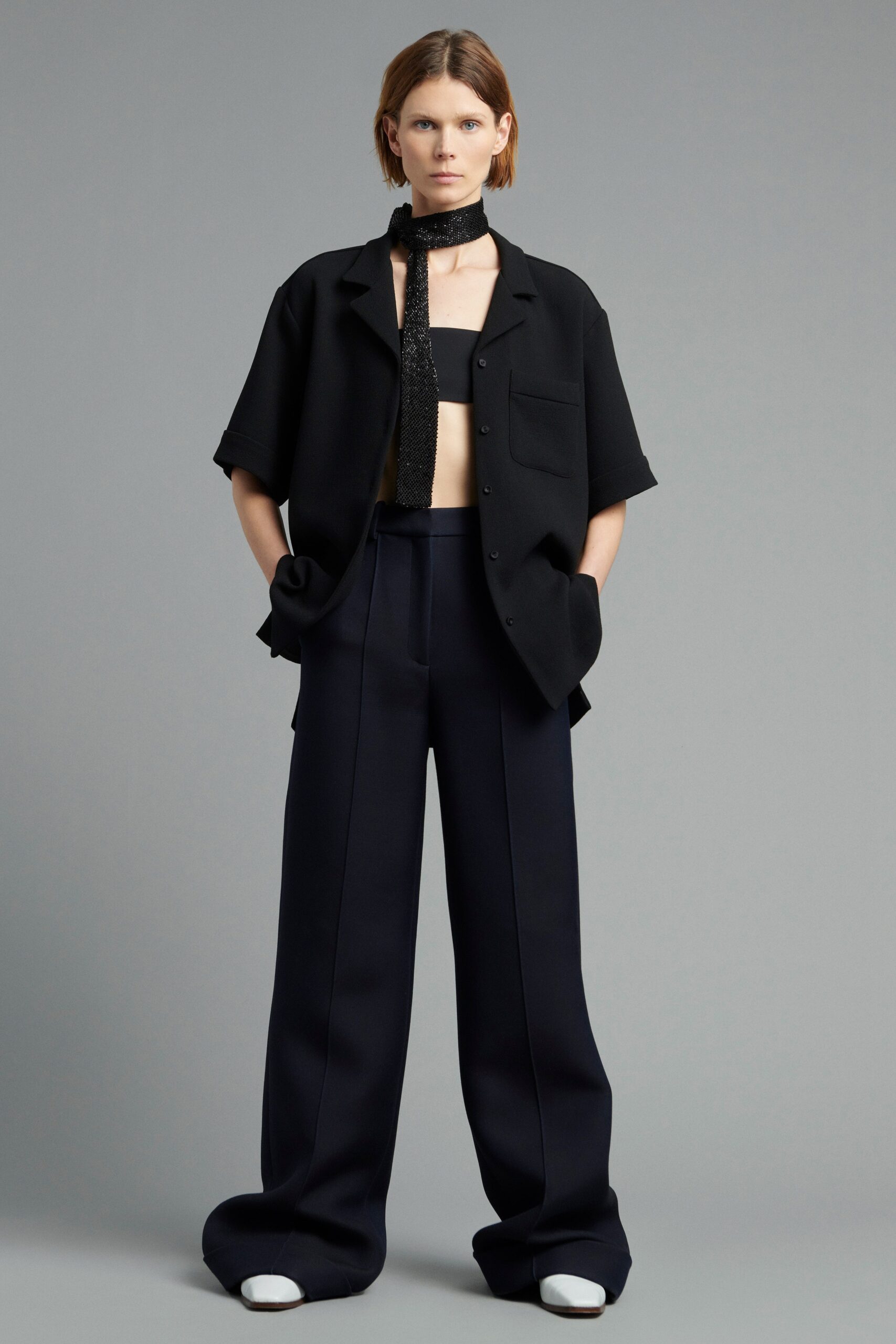 black top with navy wide-leg pants
