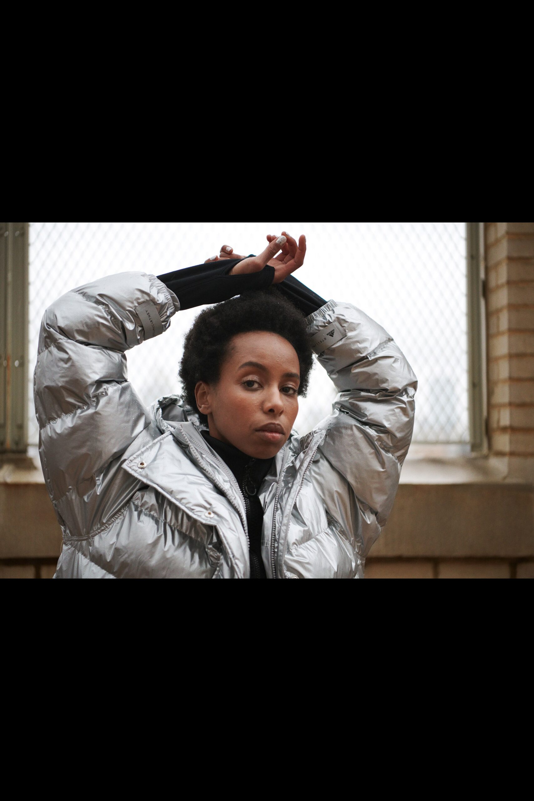 silver vinyl relaxed jacket with black top