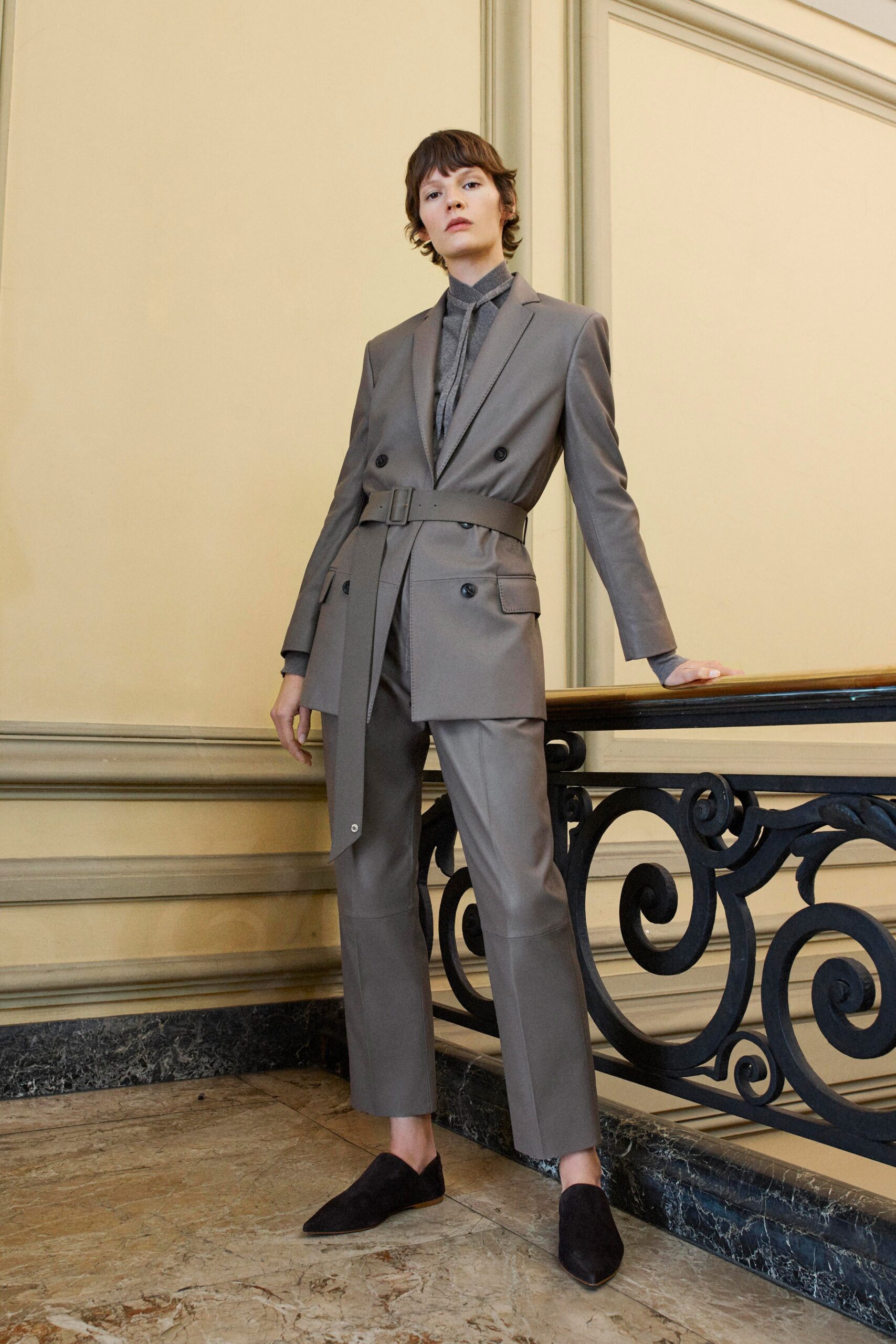 gray tailored suit with black shirt