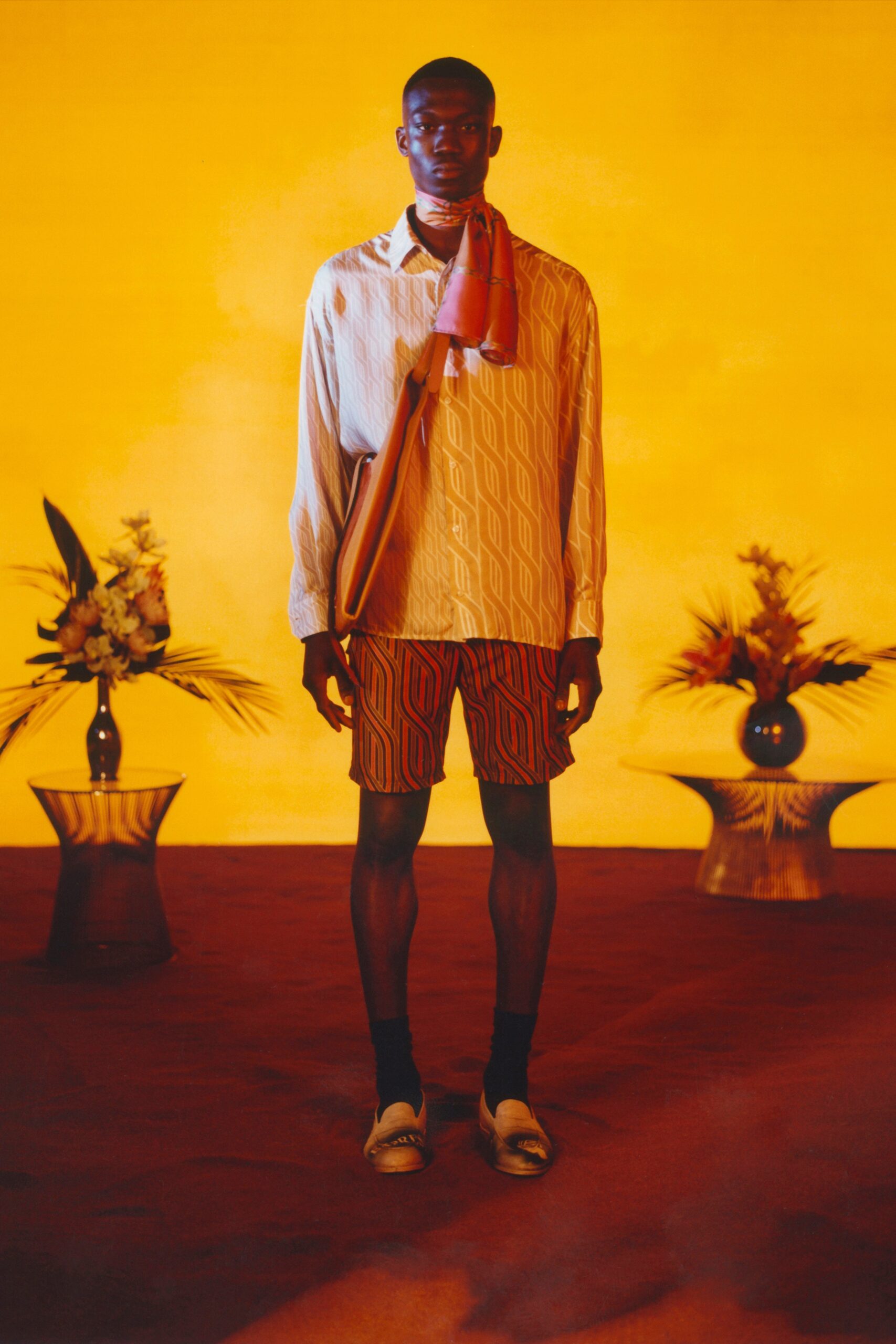 relaxed white printed shirt with orange shorts