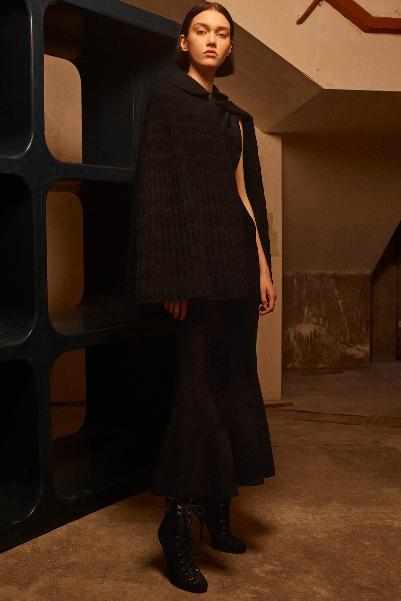 black wool cape and fitted dress