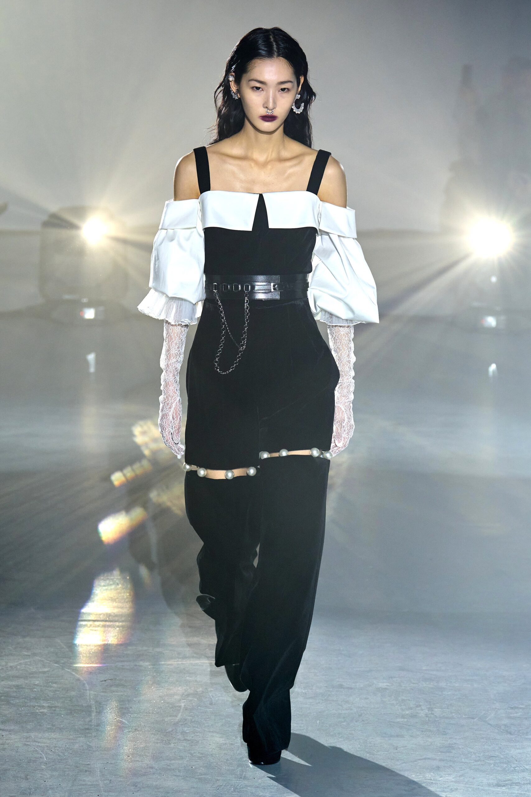 white off-shoulder top with black pants