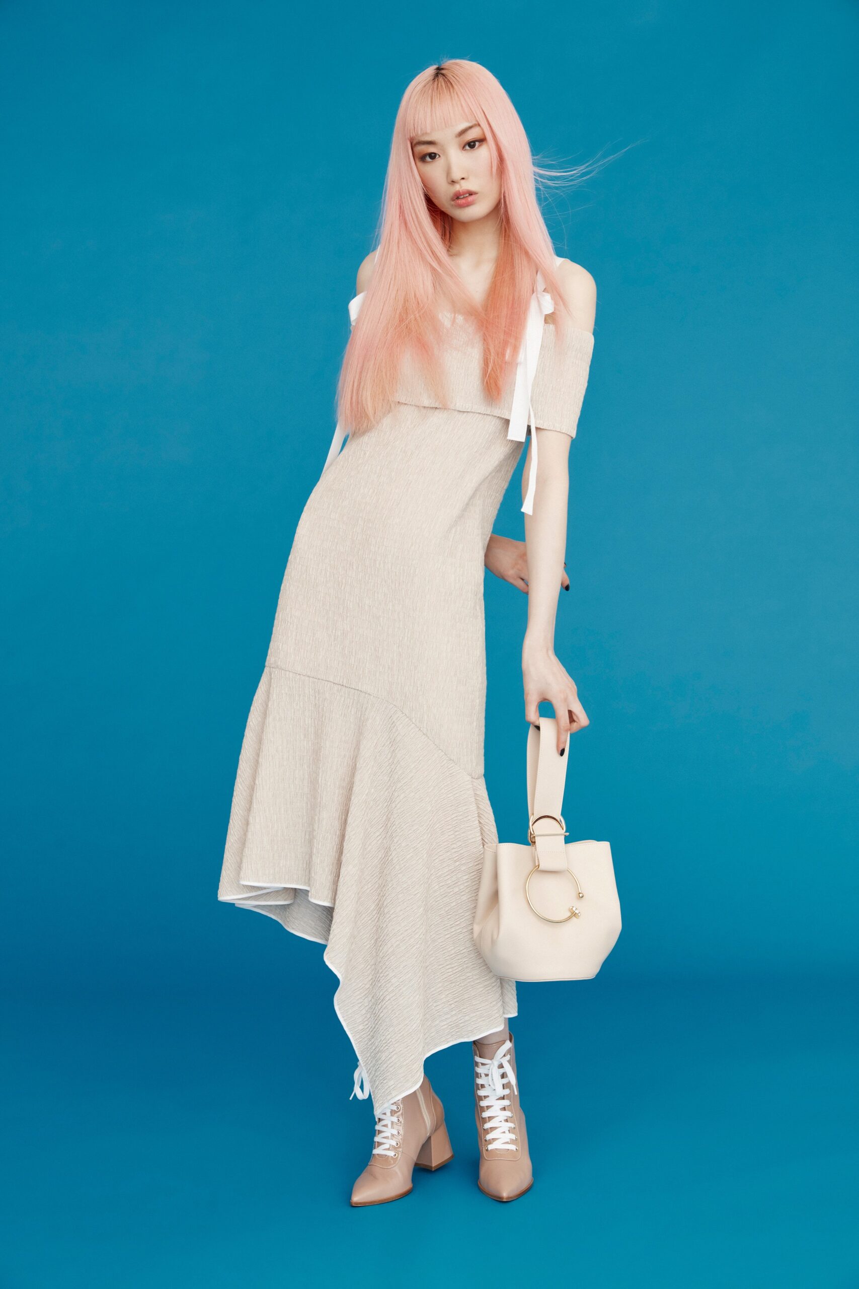 beige asymmetric dress with pointed shoes