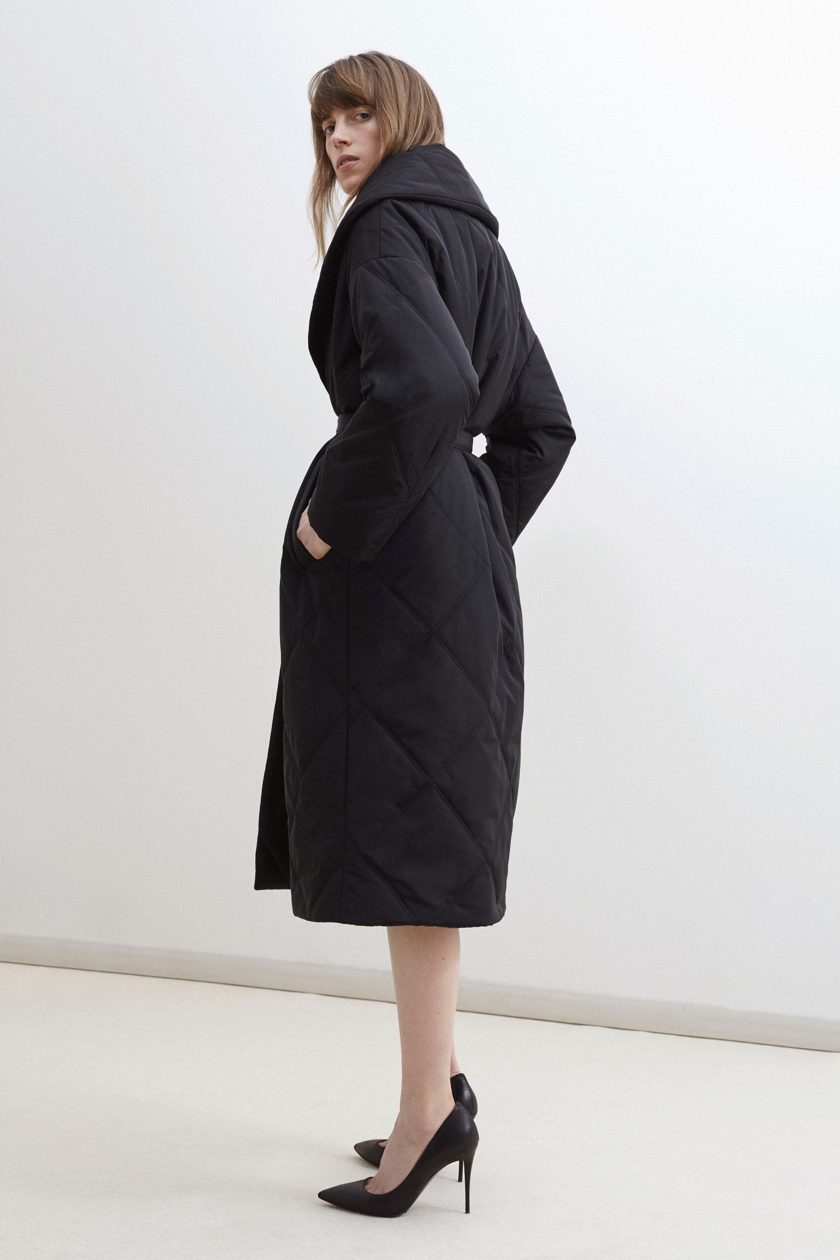 black cotton long-sleeve hooded relaxed quilted coat