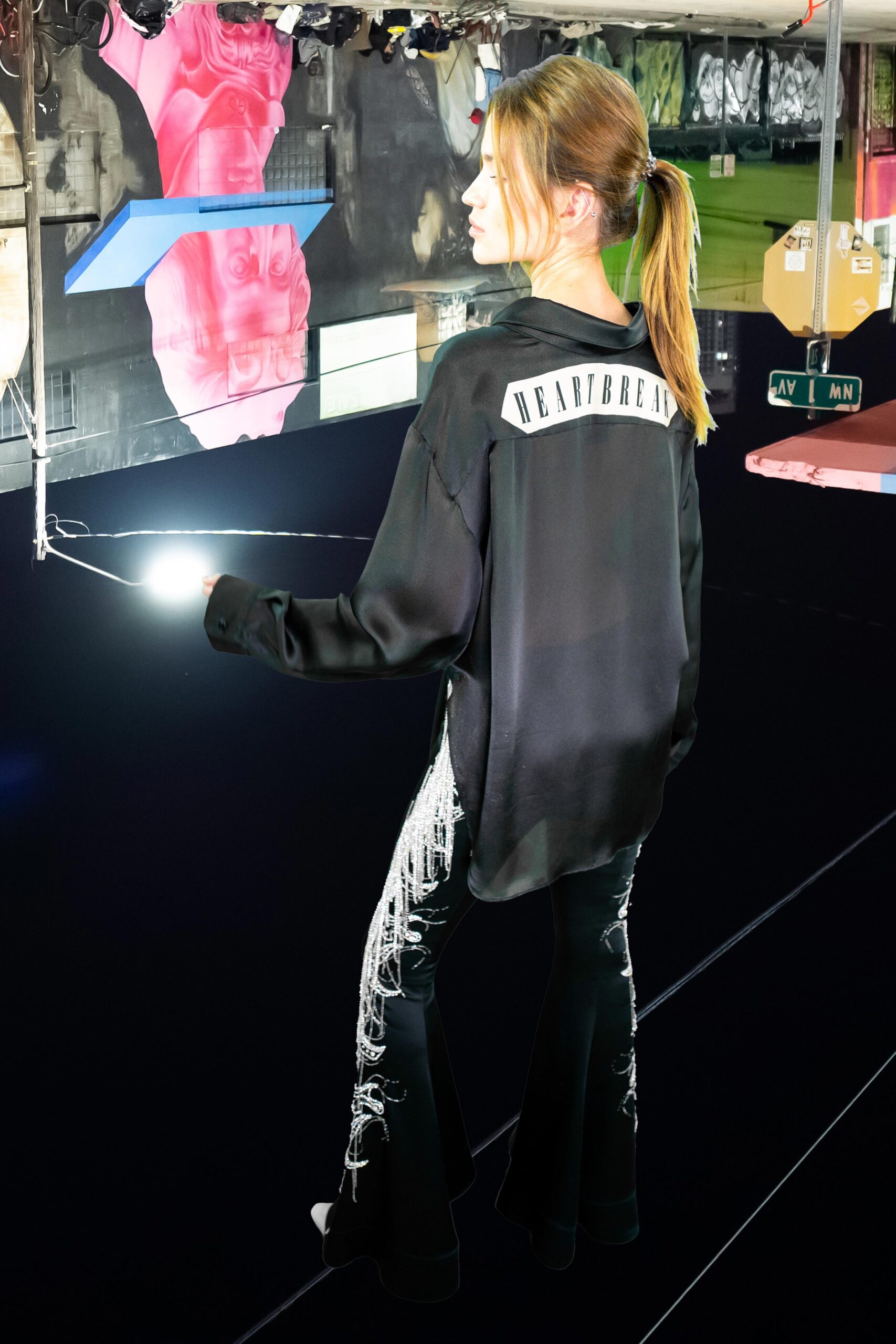 black silk shirt and flared pants