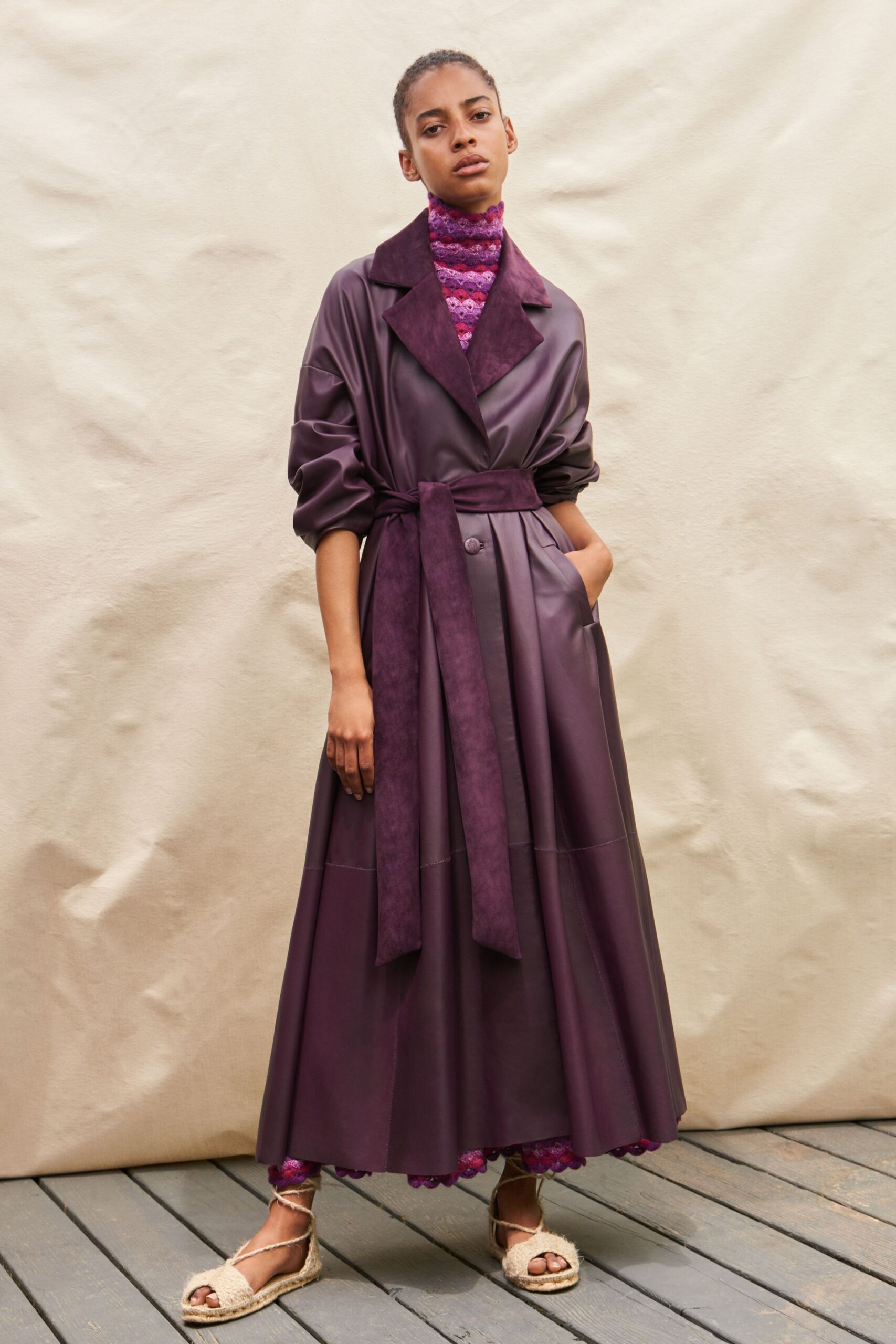 purple leather coat with knit top