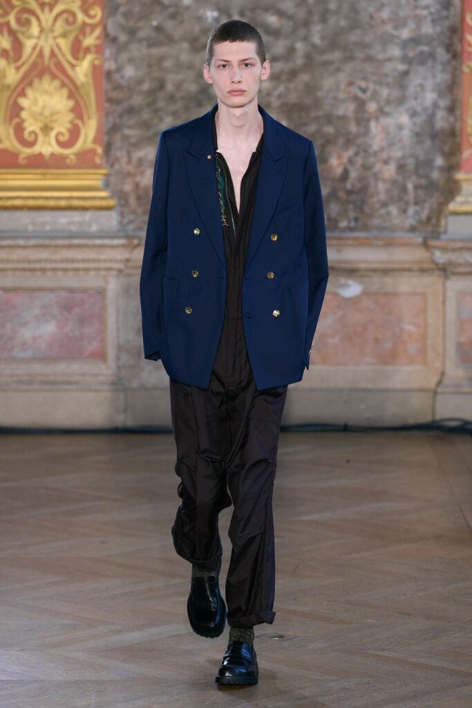 blue tailored blazer and black jumpsuit