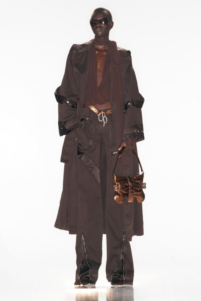 A relaxed brown denim coat paired with wide-leg pants featuring a collared neckline.