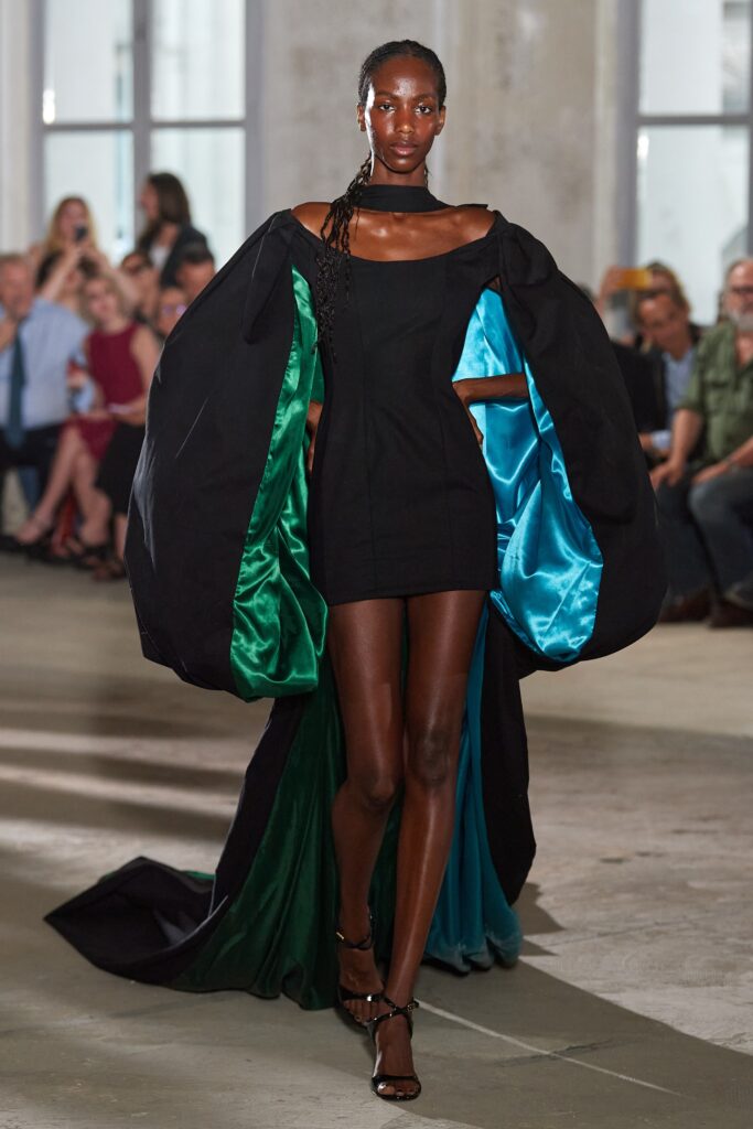 black mini dress with cape