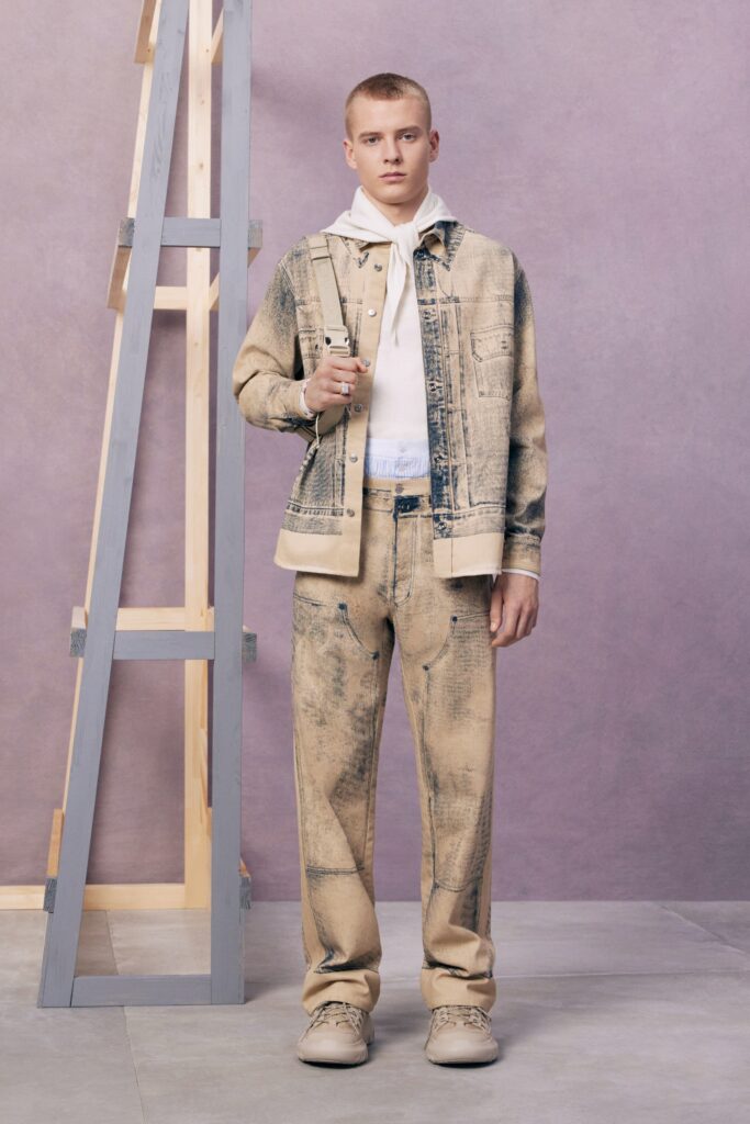 An oversized beige denim jacket paired with matching pants, creating a cohesive casual look.