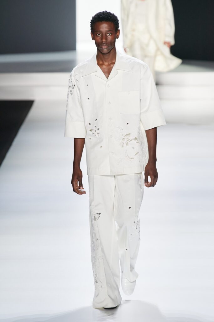A relaxed fit white shirt with short sleeves and matching embroidered pants.