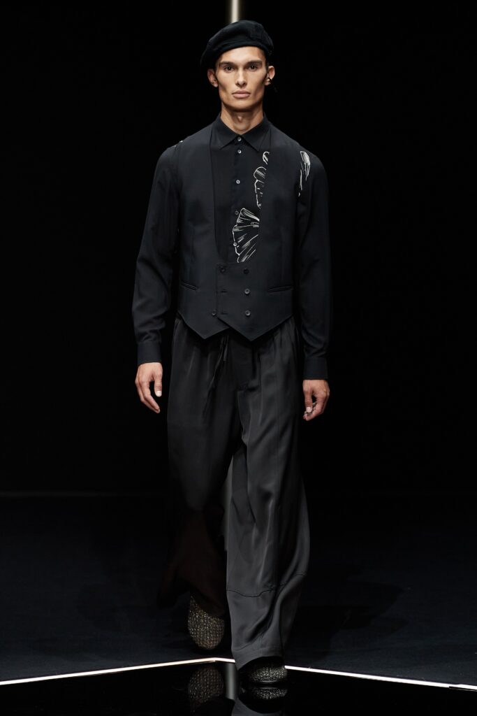 black fitted vest and shirt with relaxed pants