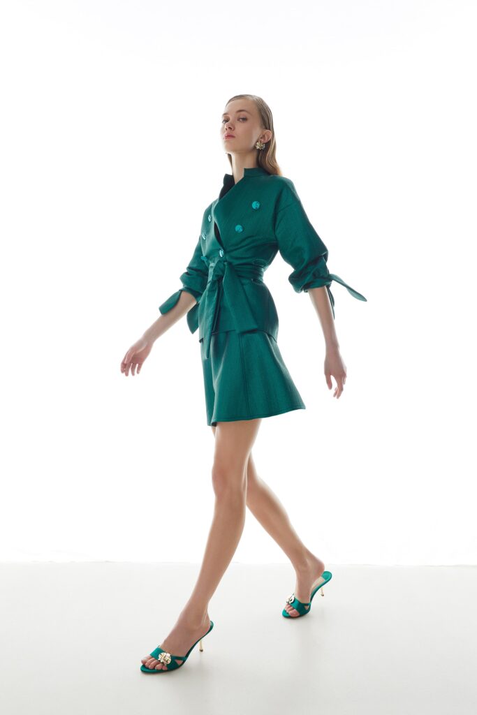 teal silk mini dress with embellished shoes