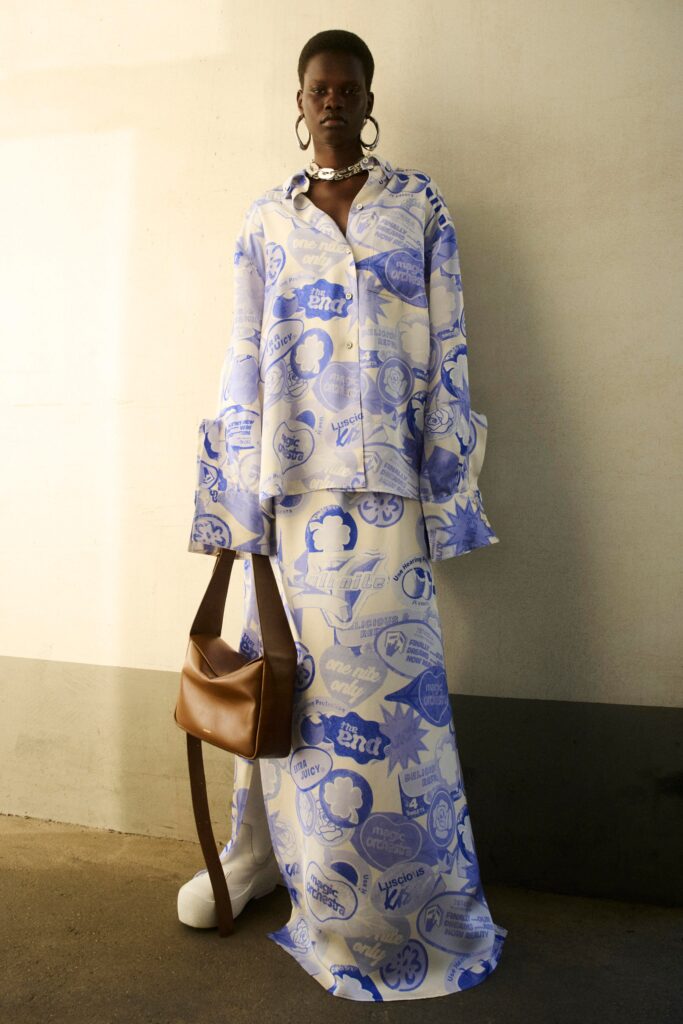 A relaxed-fit blue and white printed shirt with long sleeves and a matching skirt.