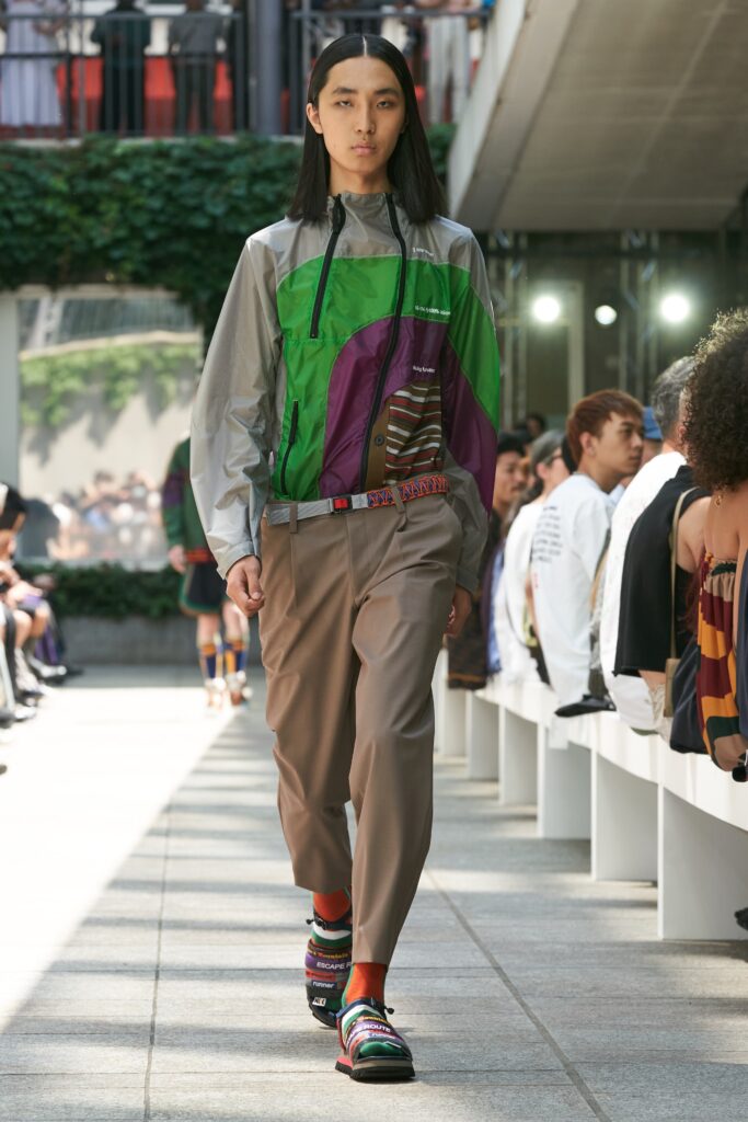 A relaxed fit color-blocked gray jacket with long sleeves paired with matching pants.