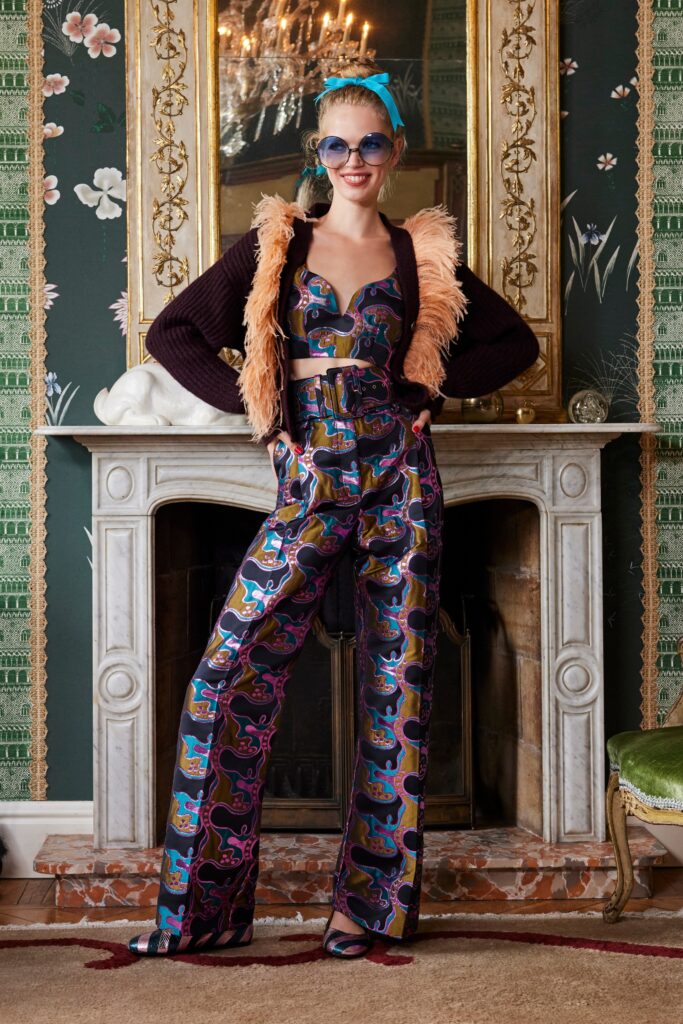 A fitted multicolor silk top with a collar paired with printed pants.