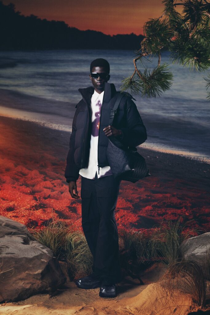 A relaxed black jacket with long sleeves and collared design paired with matching pants.